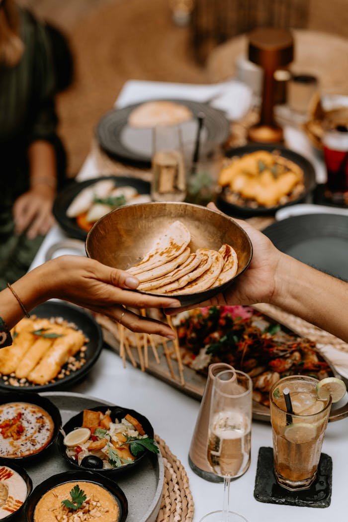 A lavish spread of exotic dishes on a beautifully set dining table, capturing a luxurious dining experience.